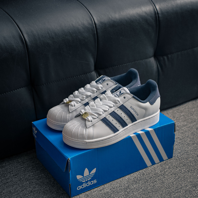 adidas Originals Superstar Shell Toe Sneakers for Men Women,  White Leather Navy Blue 3-Stripes Retro Casual Walking Trainers